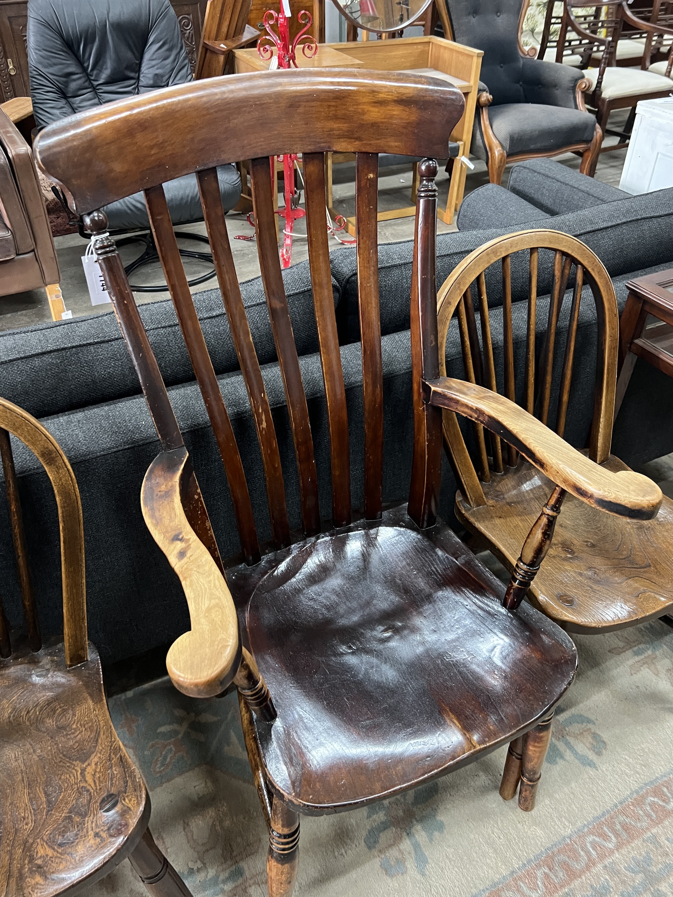 A Victorian elm and beech lathe back Windsor armchair, width 56cm, depth 47cm, height 114cm together with two Victorian Windsor comb back kitchen chairs